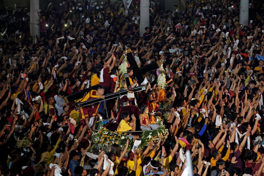 Catholic devotees wave their hand as the procession ends on its feast day, in Manila Catholic devotees wave their hand as the procession ends on its feast day in front of the Minor Basilica of the Black Nazarene in Manila, Philippines, January 10, 2019. REUTERS/Soe Zeya Tun SOE ZEYA TUN