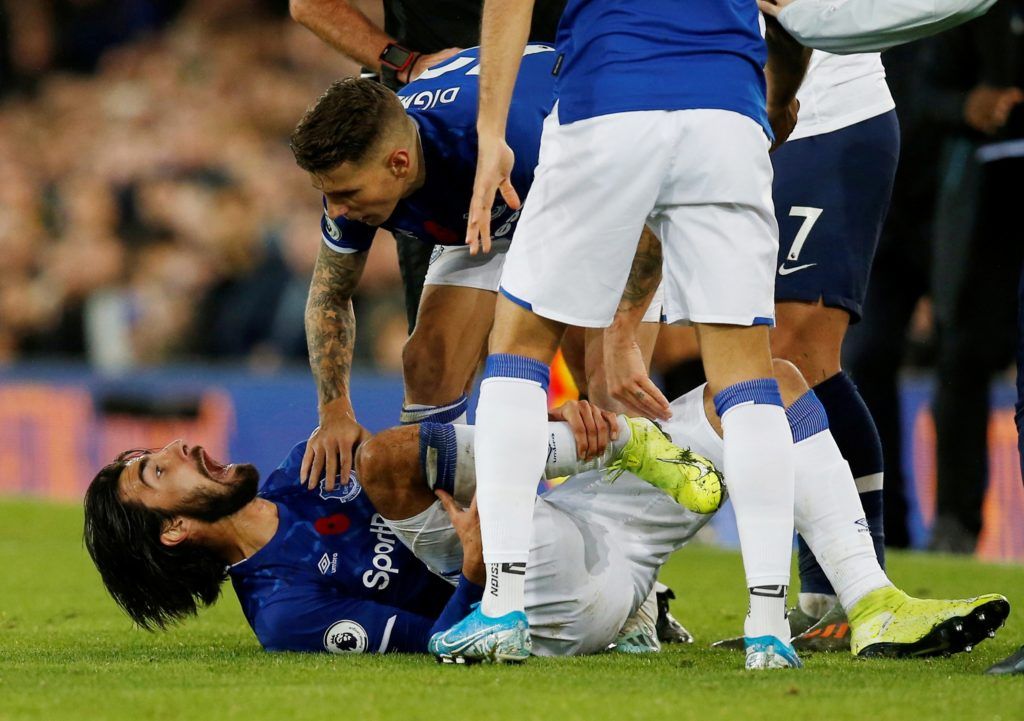 Premier League - Everton v Tottenham Hotspur Soccer Football - Premier League - Everton v Tottenham Hotspur - Goodison Park, Liverpool, Britain - November 3, 2019  Everton's Andre Gomes reacts after sustaining an injury   REUTERS/Andrew Yates  EDITORIAL USE ONLY. No use with unauthorized audio, video, data, fixture lists, club/league logos or 