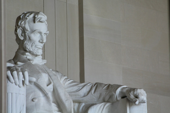 white concrete statue of man, abraham lincoln
